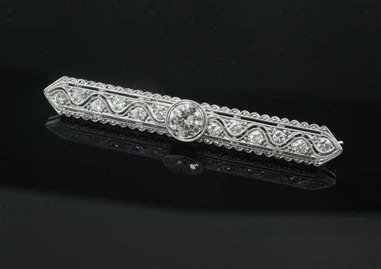 An early 20th century style 18ct white gold and diamond set bar brooch, 57mm.